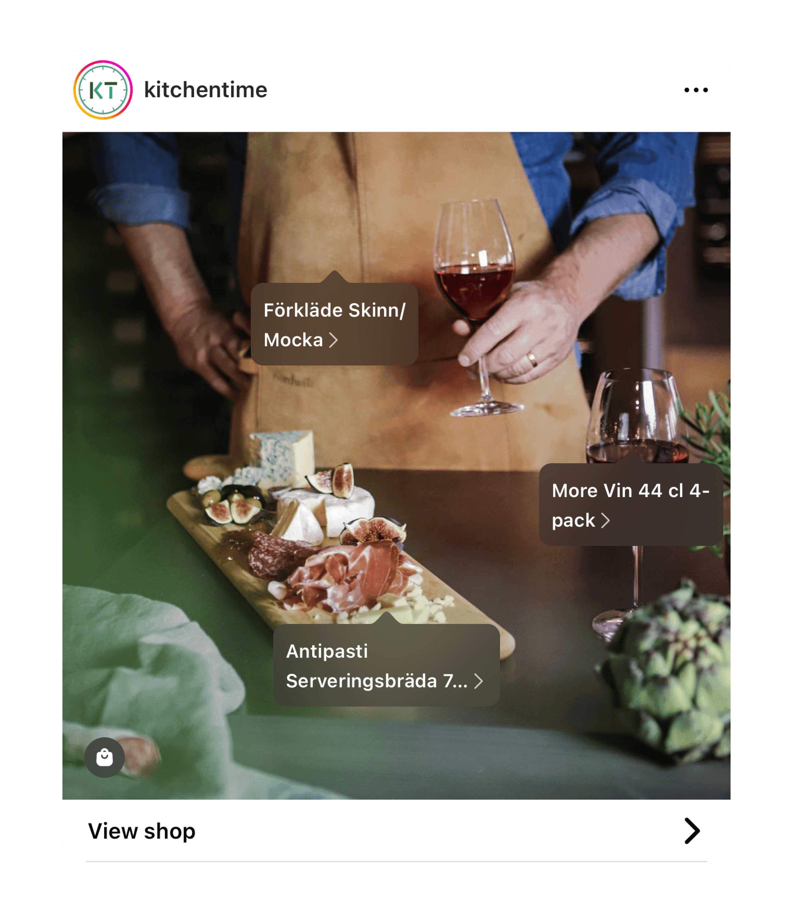 a person holding a wine glass above a dinner table